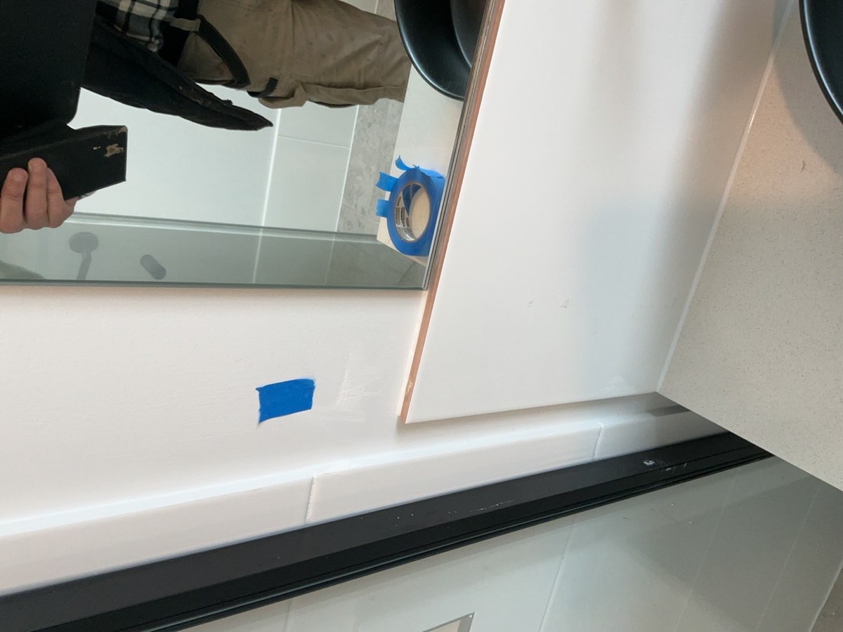 Bathroom painting, recorded during a handover inspection in Oran Park