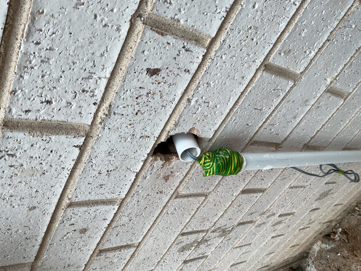 Pipe penetrations to be sealed, recorded during a handover inspection in Oran Park